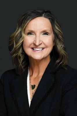 Dorothy smiling in a business suit